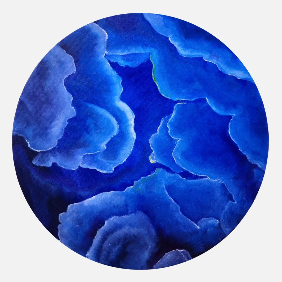 Abstract painting with blue and purple cloud-like shapes inside a circular frame.