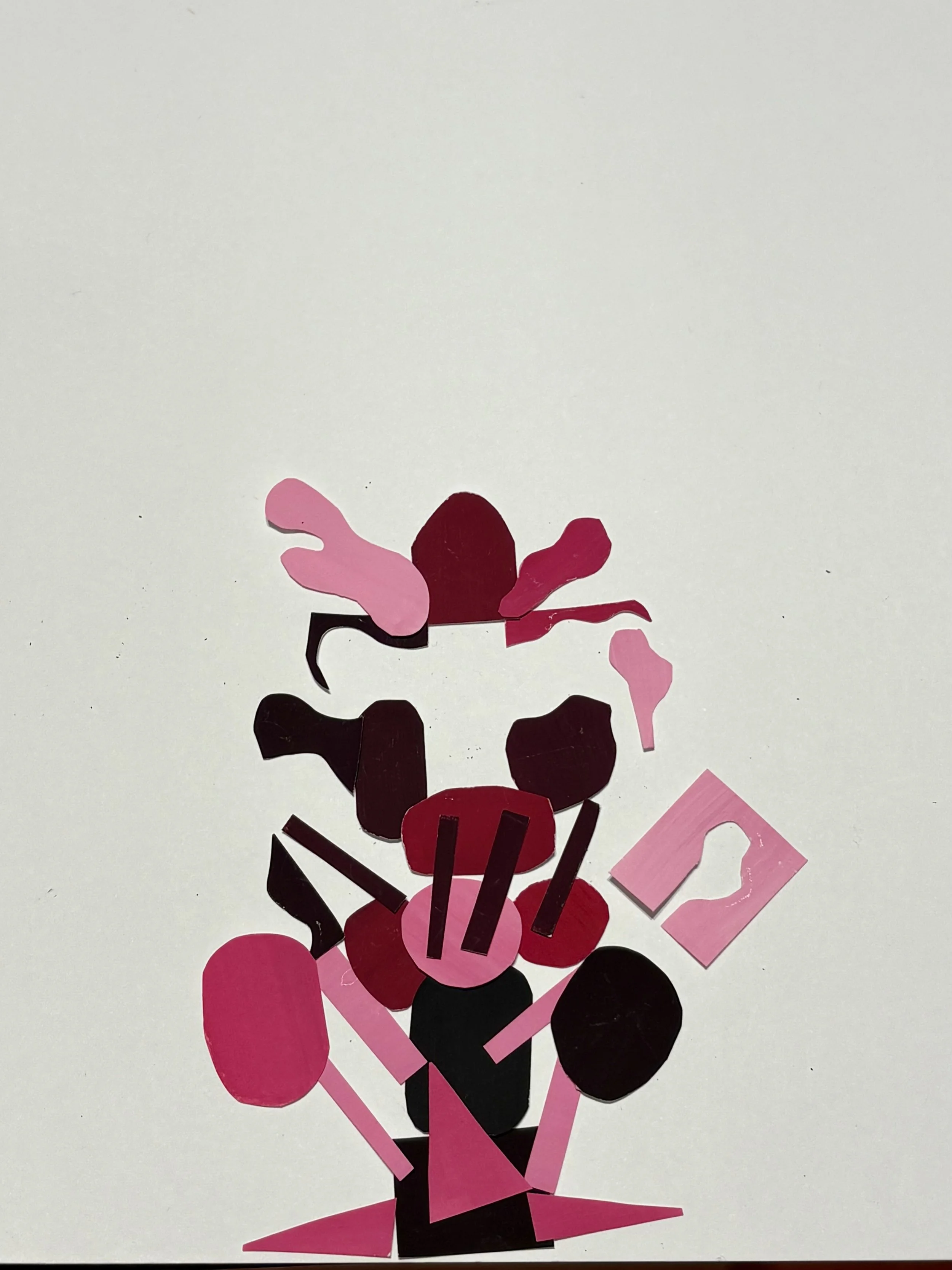 Abstract collage of various shaped cutouts in pink, black, and red on a white background, arranged in an abstract composition.