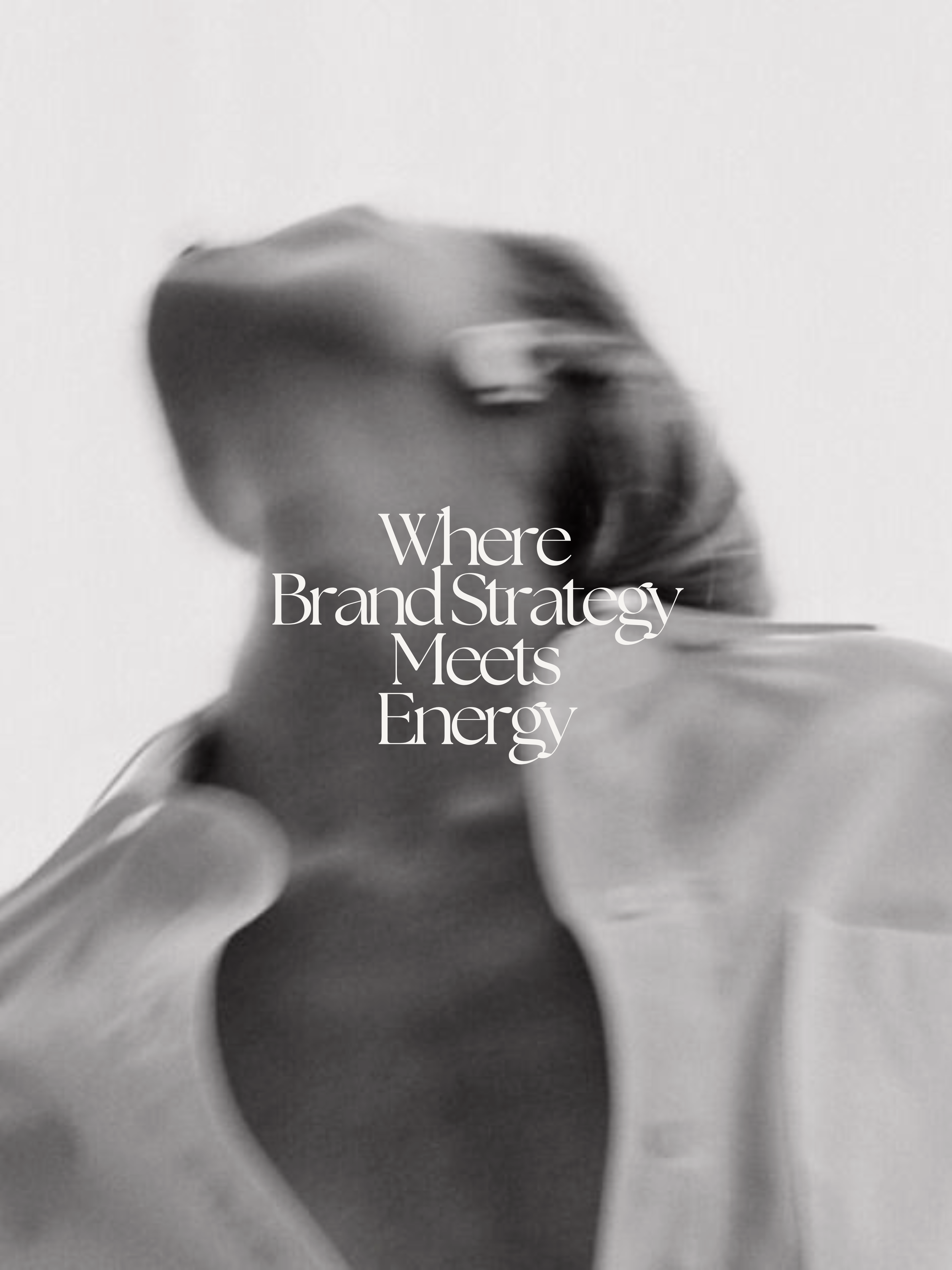 Black and white photo of a person with long hair, wearing sunglasses, with a caption overlay reading "Where Brand Strategy Meets Energy."