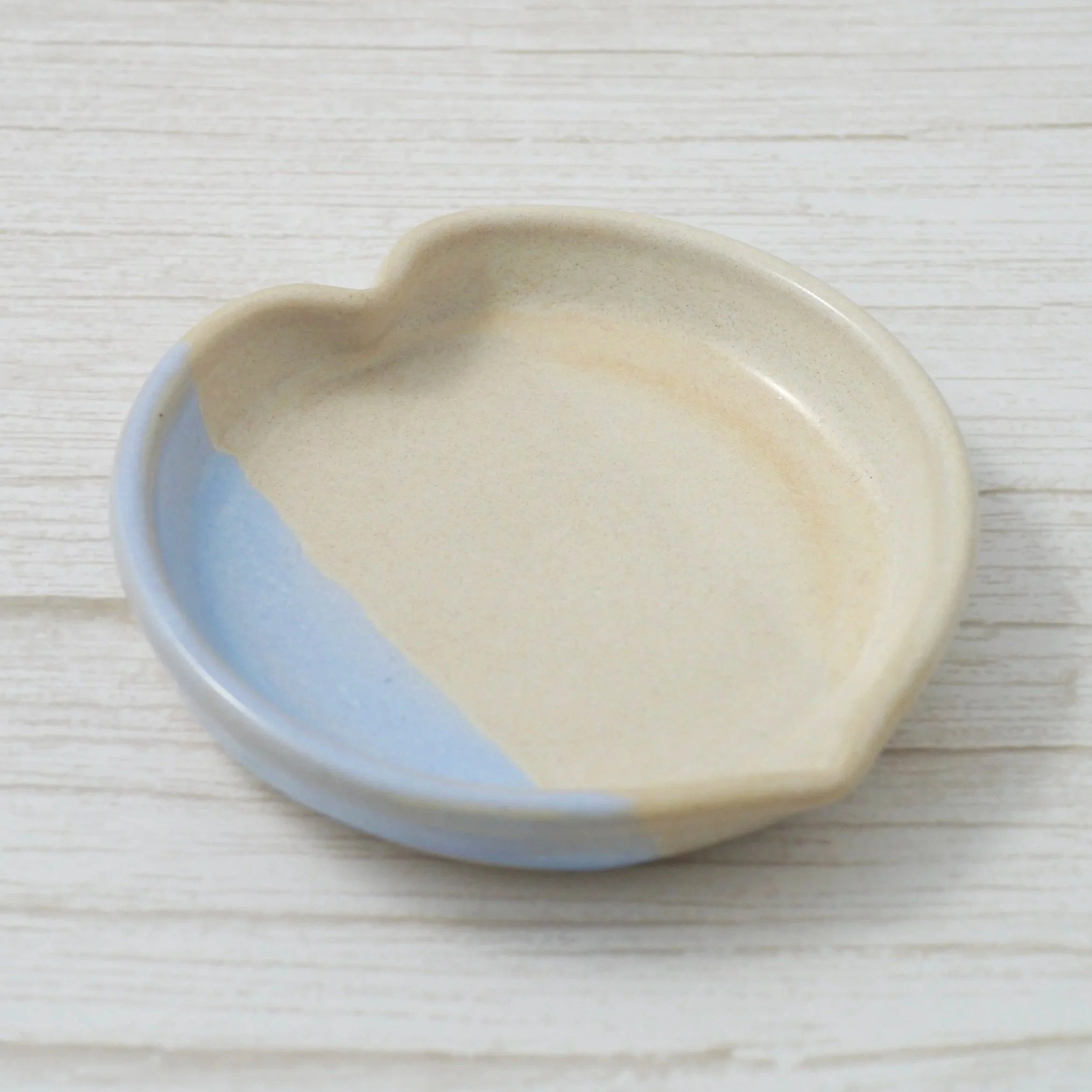 Heart shaped trinket dish. Each dish is lovingly crafted on my potter’s wheel from premium white stoneware clay and finished with a beautiful blend of beige and blue glazes.
