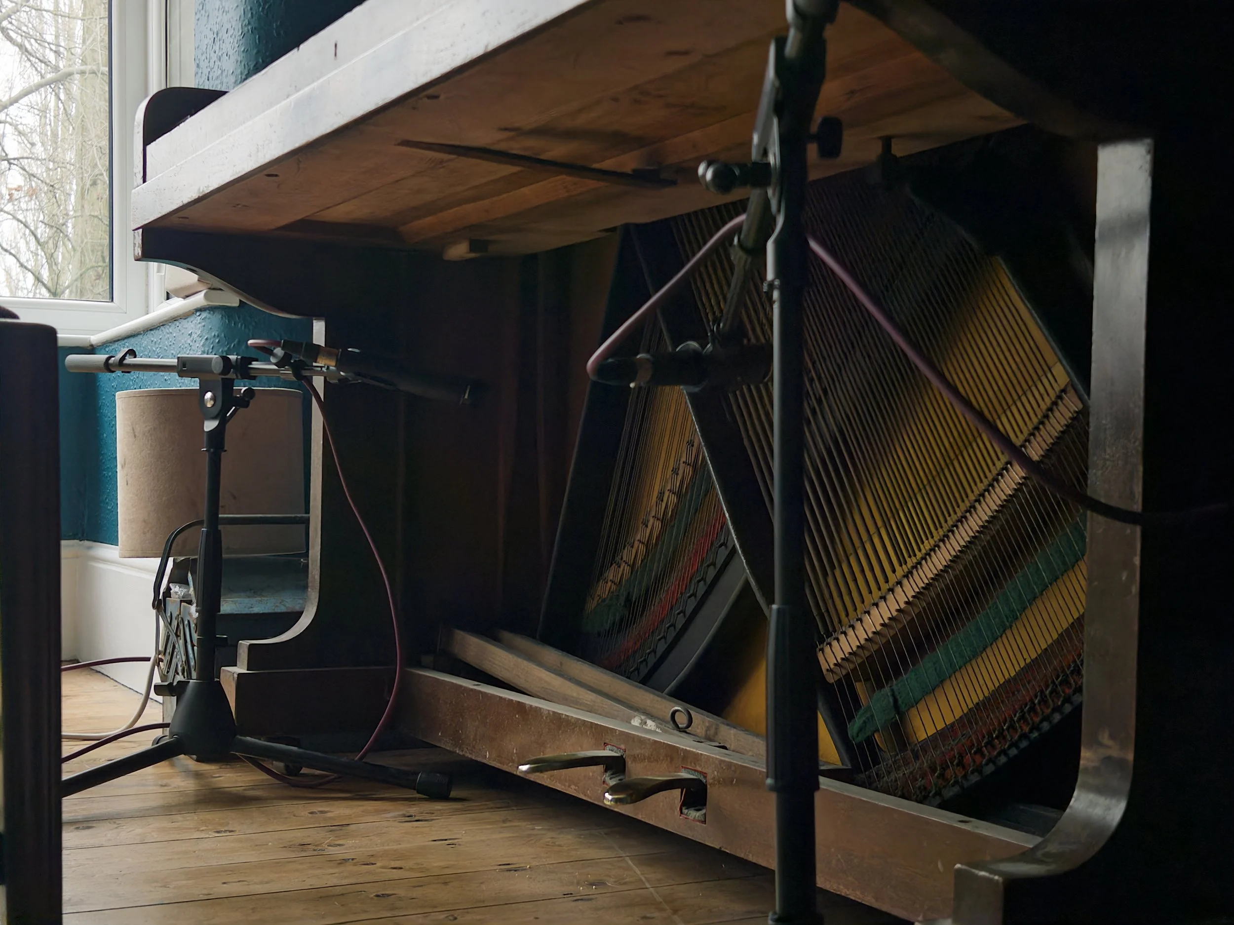 Microphone pair underneath key bed from right side.