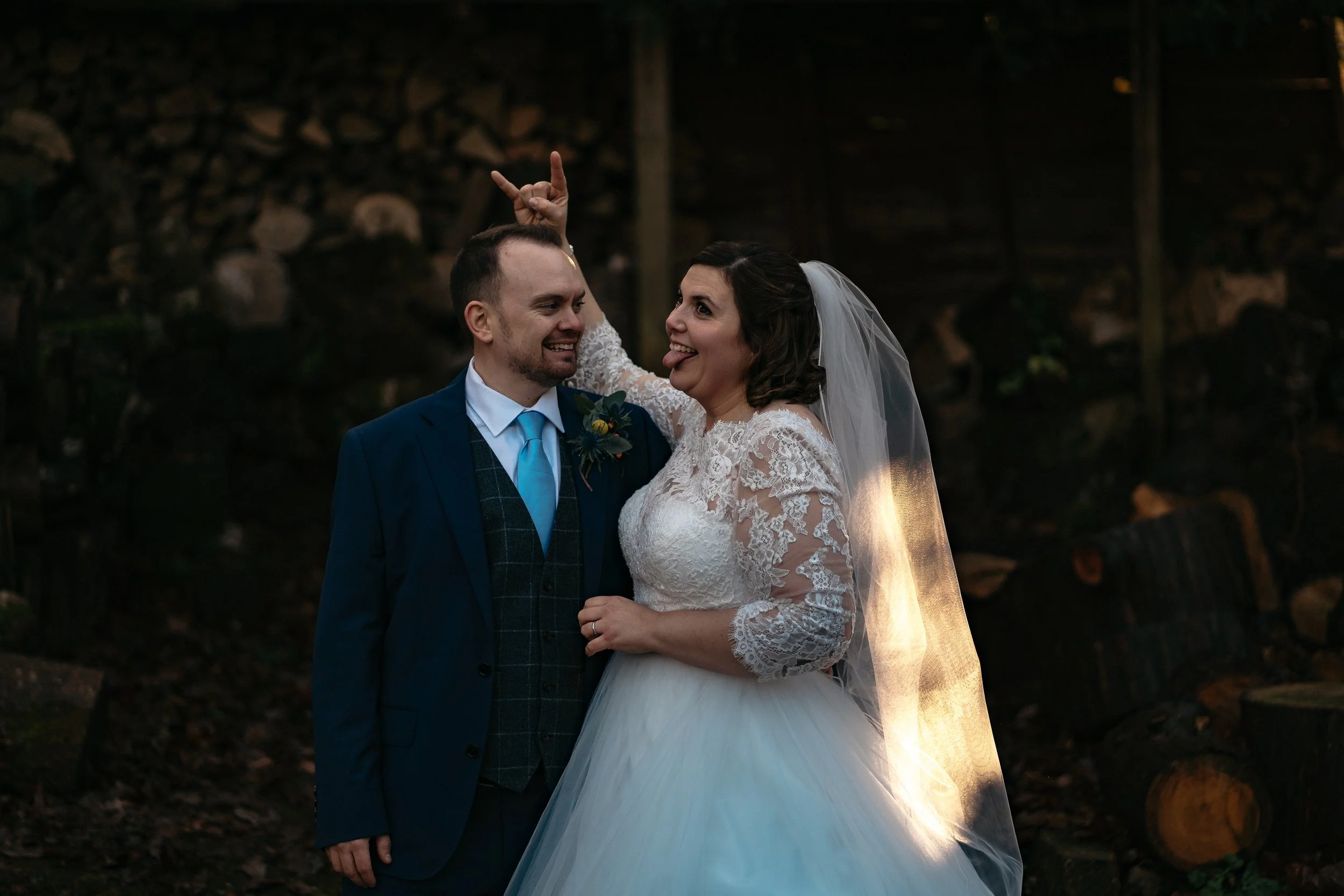 Unique wedding Bride having fun portrait Clearwell Castle Forrest of dean