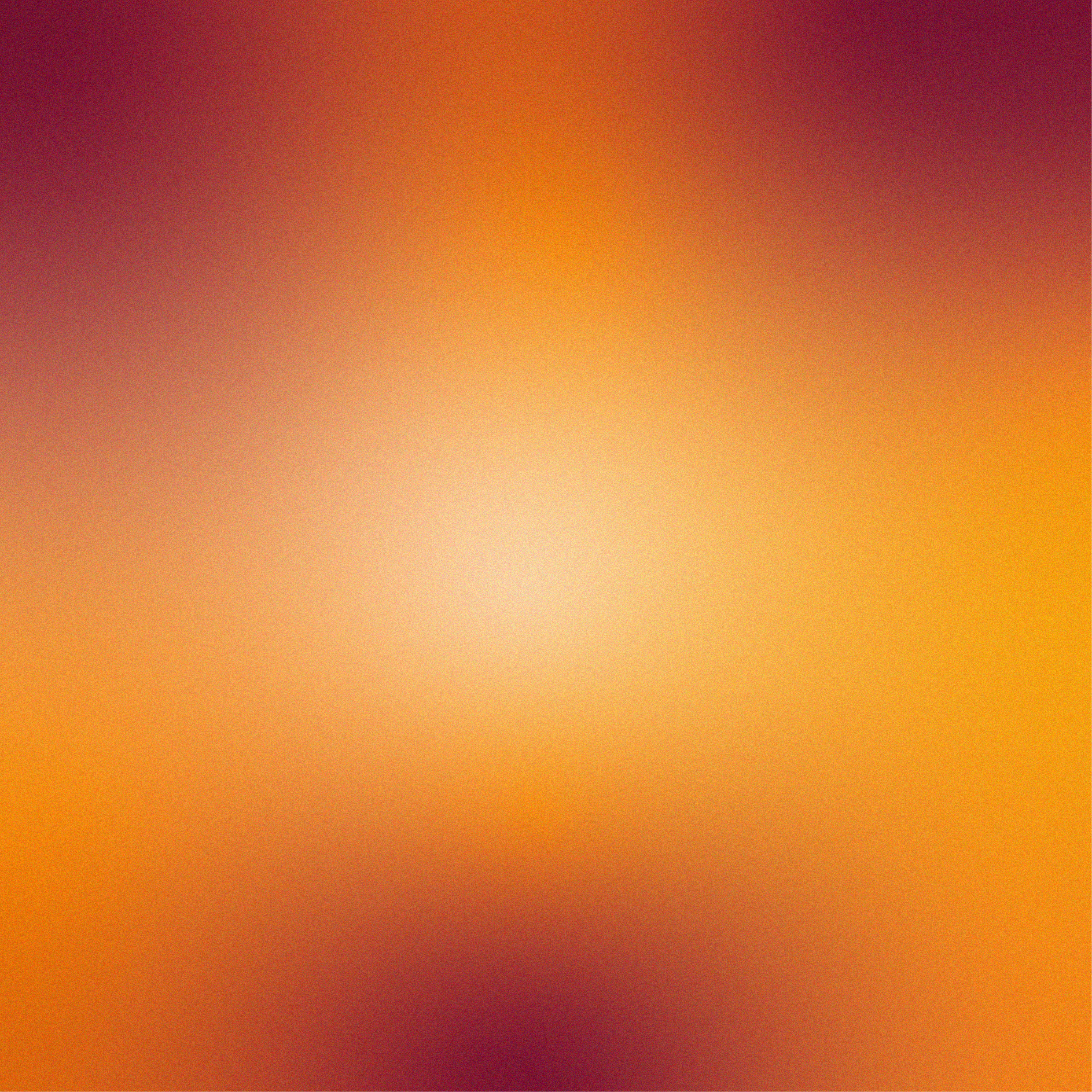 Blurred, warm-toned background with gradient shades of orange, yellow, and red.