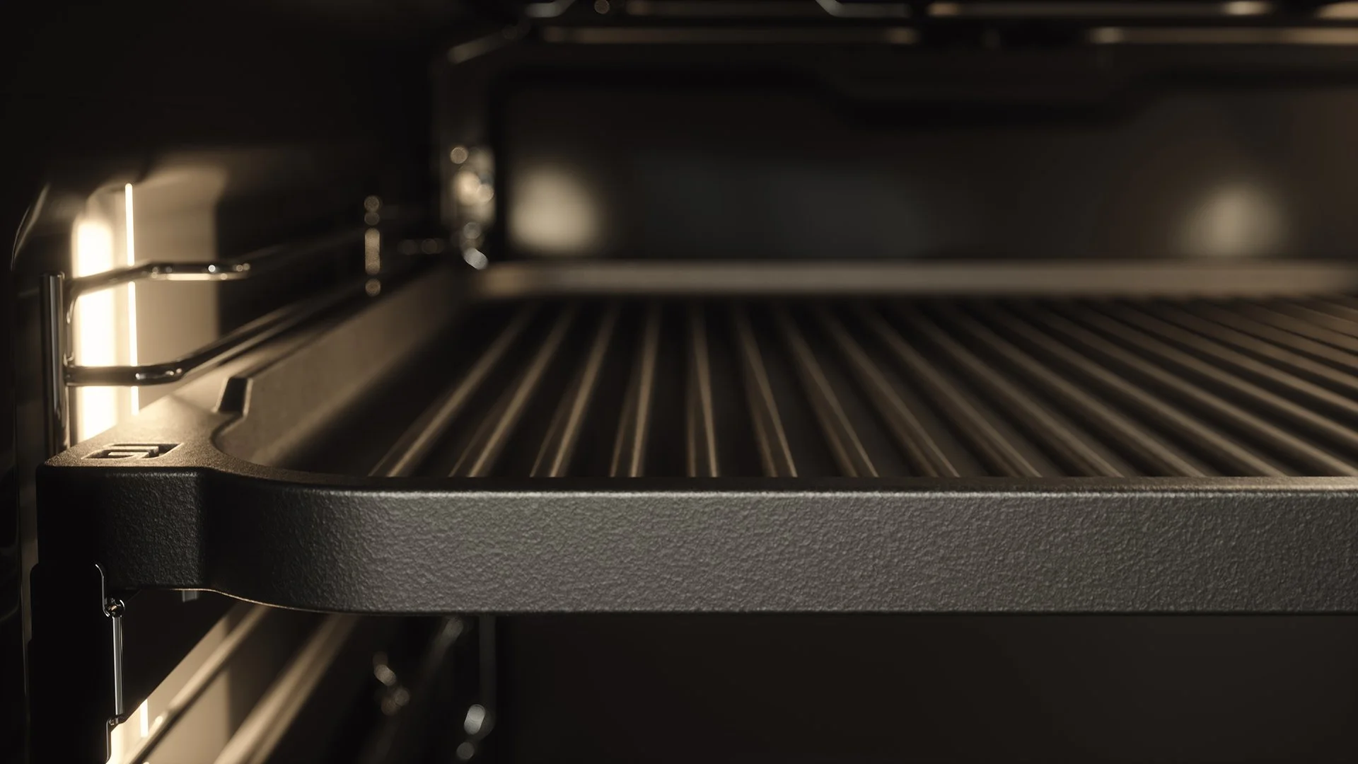 Empty oven interior with a grill rack.
