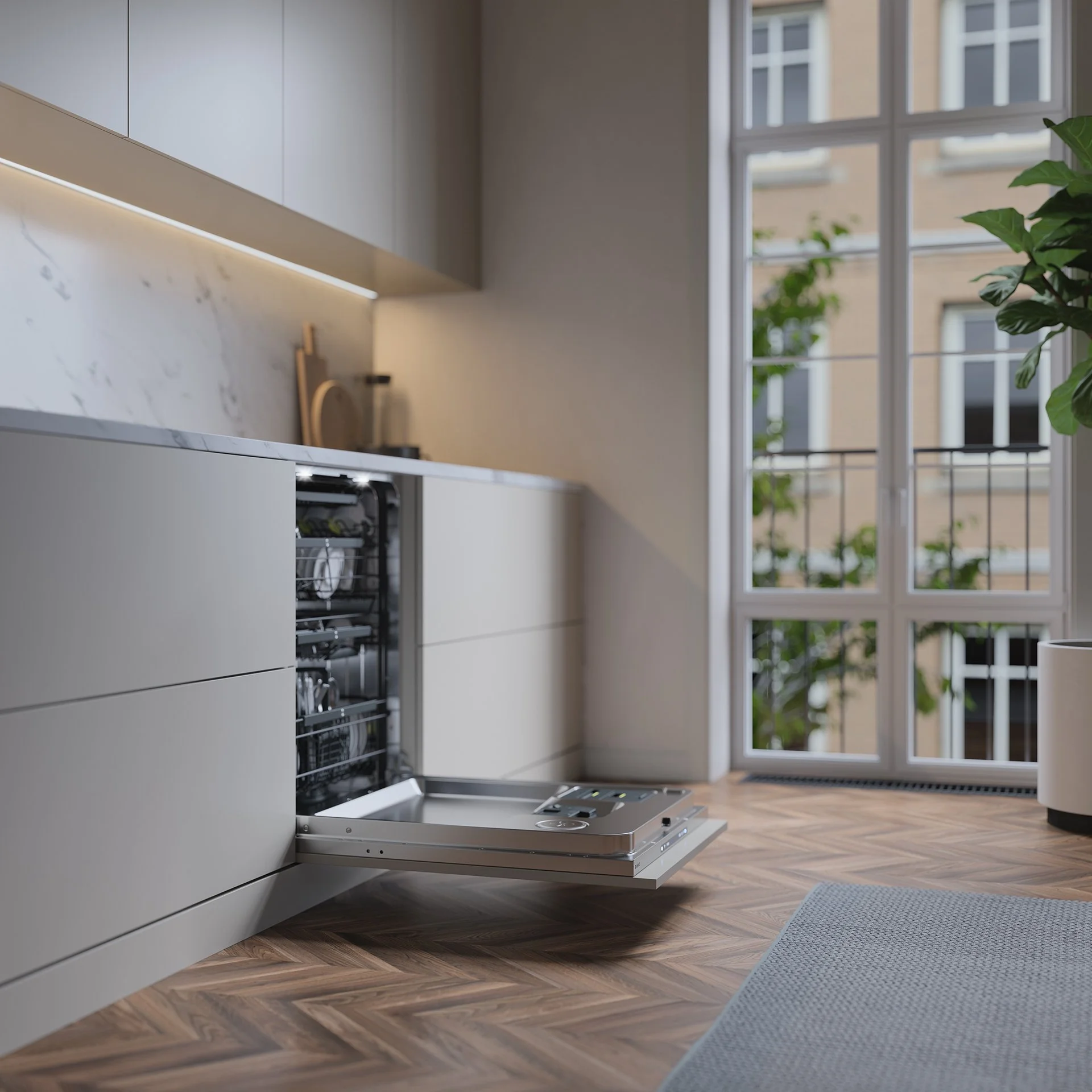 Modern kitchen with an open dishwasher, light-colored cabinets, marble countertop, hardwood floor, large window, and a potted plant.