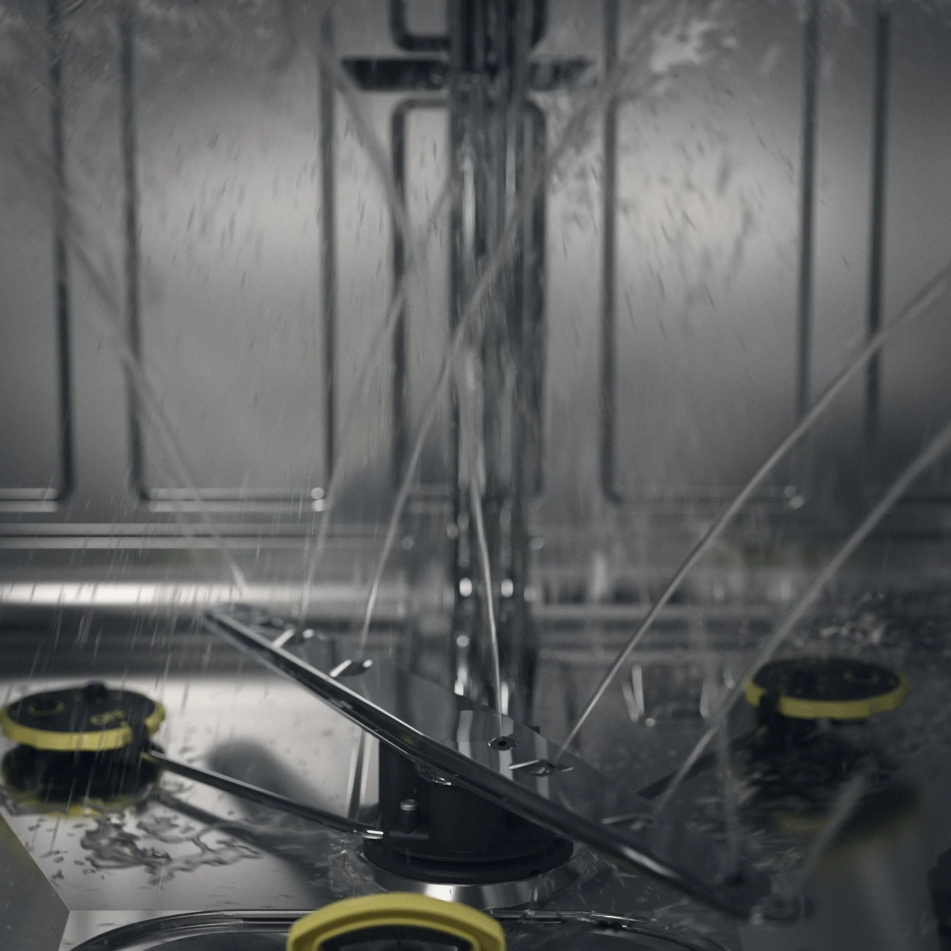 Close-up view of a laboratory or industrial equipment with metal and plastic components, featuring wires and fasteners, possibly an electrical or mechanical apparatus.