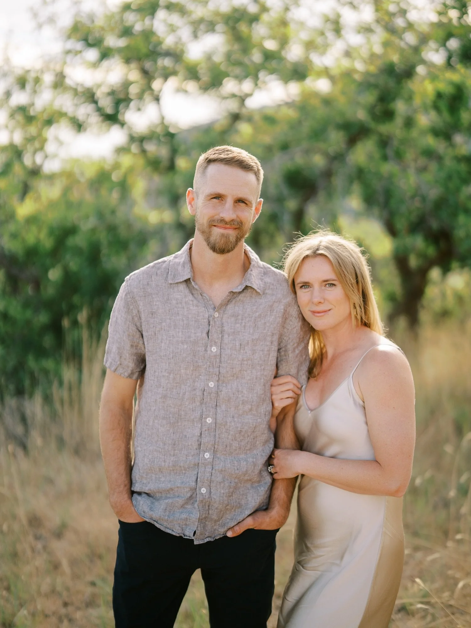 Close portrait of an engaged couple in soft summer light