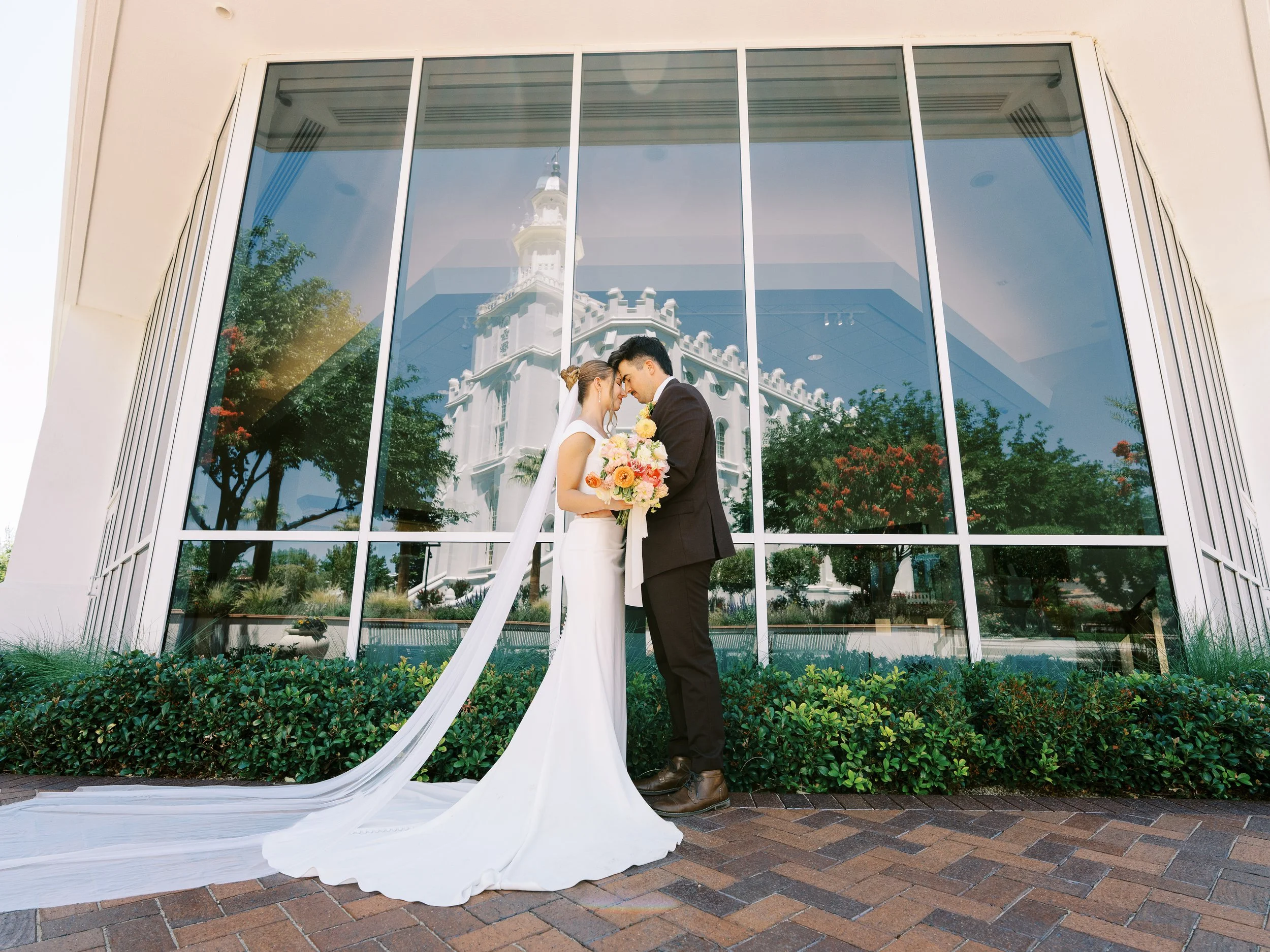 Abby and Noah framed by a tall window at the temple