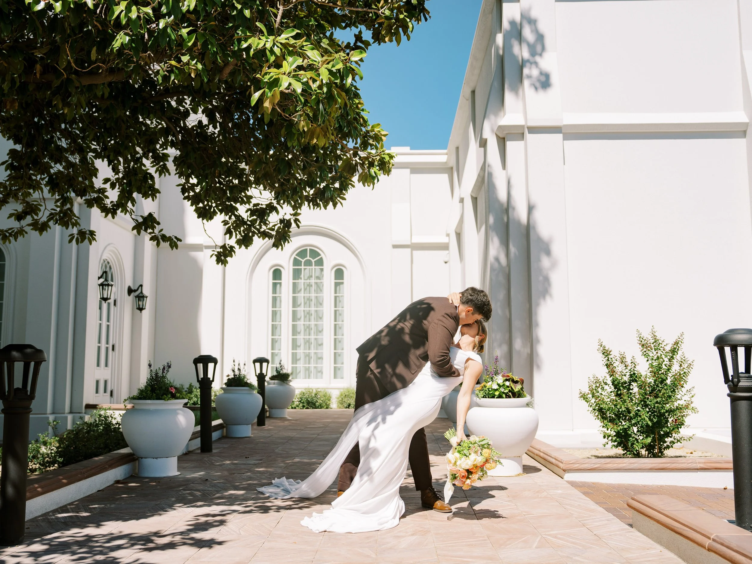 Noah dipping Abby for a kiss outside the St. George Temple