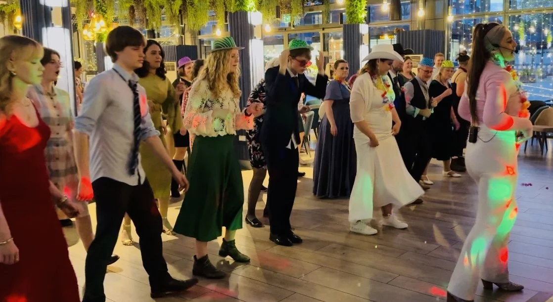 Dazzle Dance Experience wedding entertainment line dancing host leading guests at wedding reception unique wedding activity