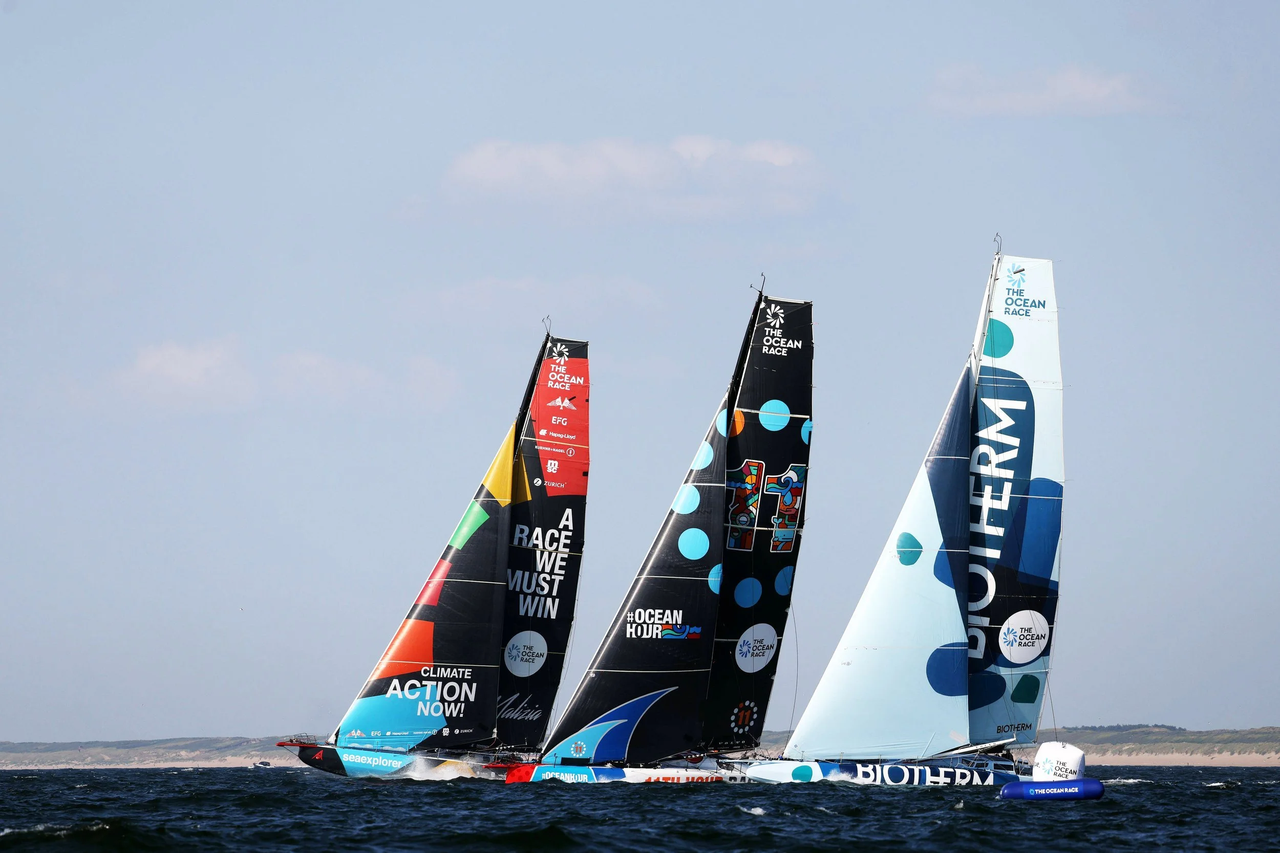 Three sailing boats competing in The Ocean Race