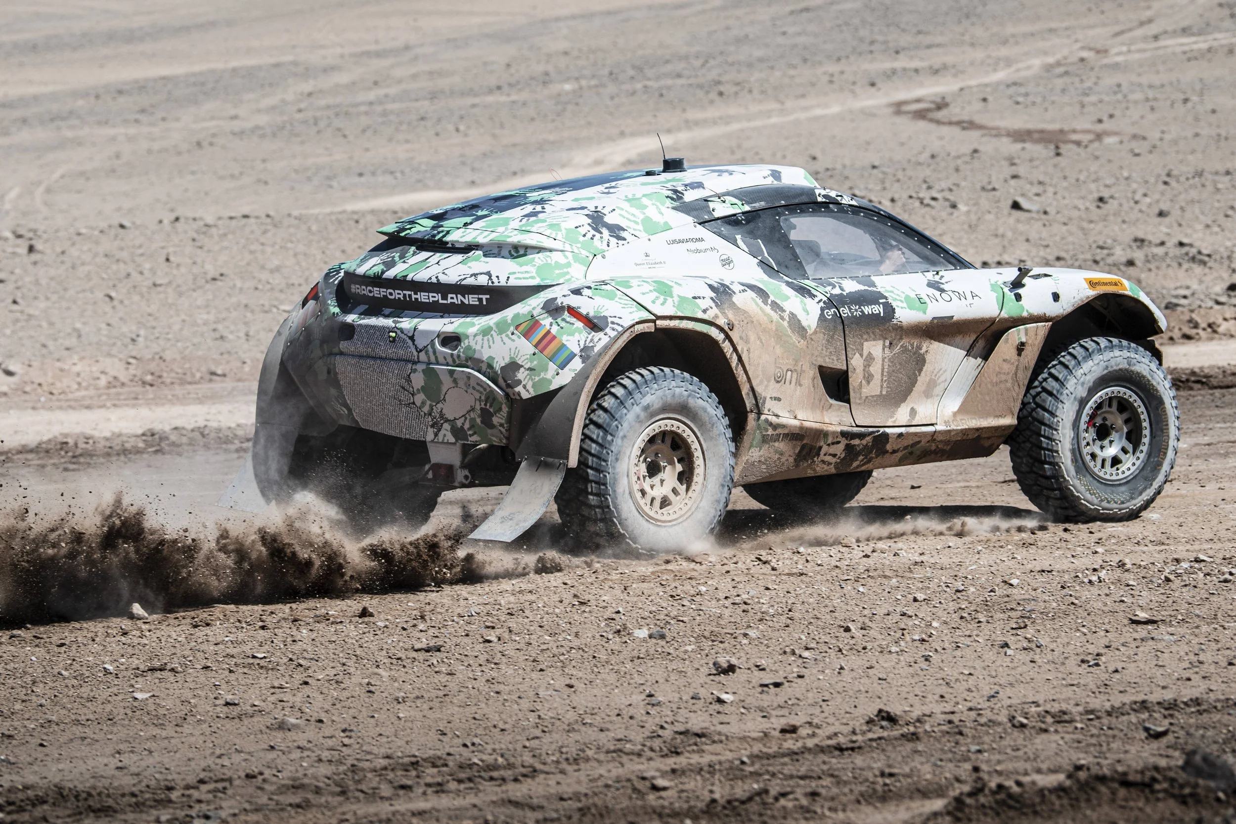 Extreme E race car with “Race for the Planet” message on the rear.