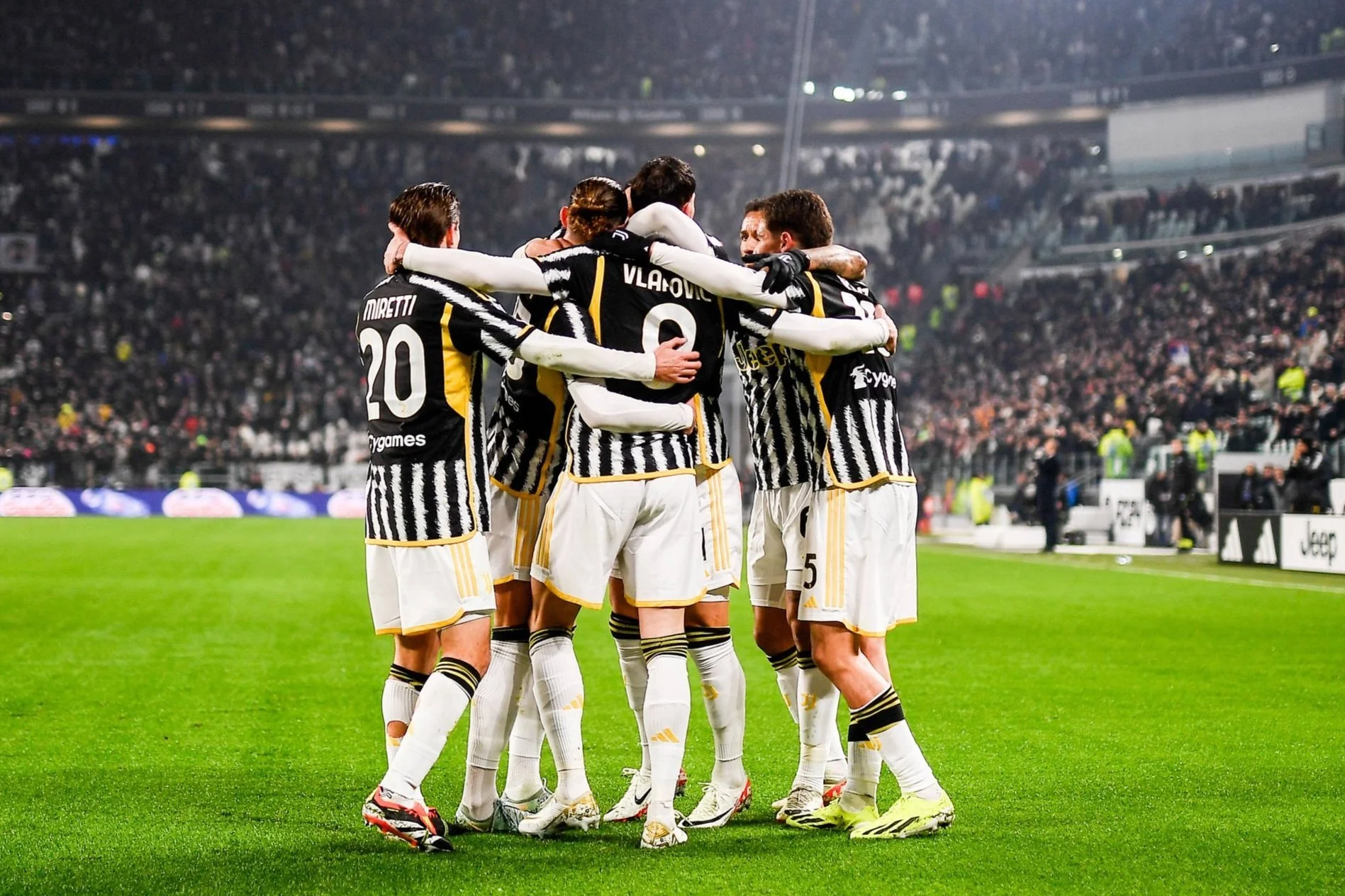 Juventus players celebrating a goal during a match.