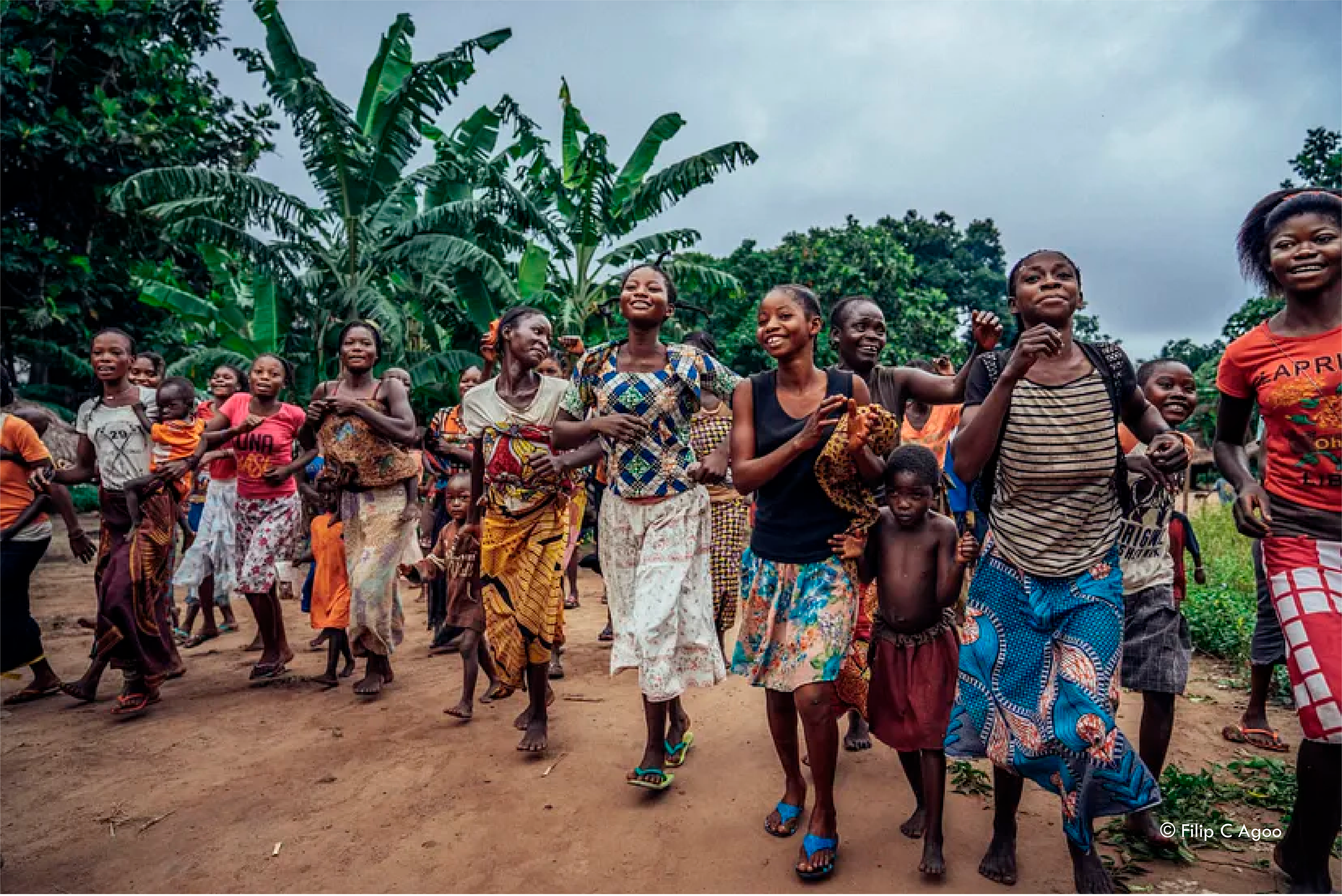 Women and children dancing at a community event in Mai Ndombe