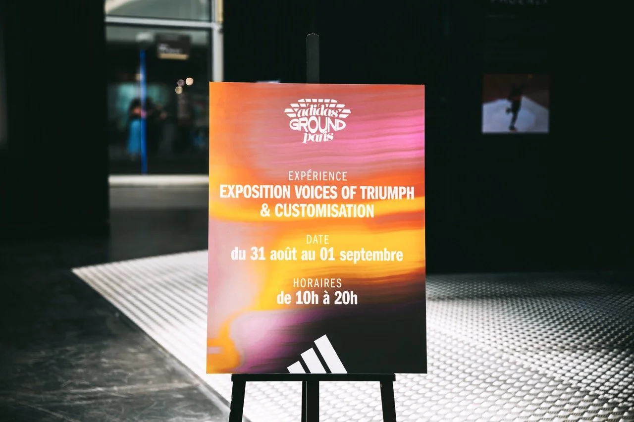 A sign outside of the adidas Rising Phoenix activation at Paris 2024, advertising the Rising Phoenix panel