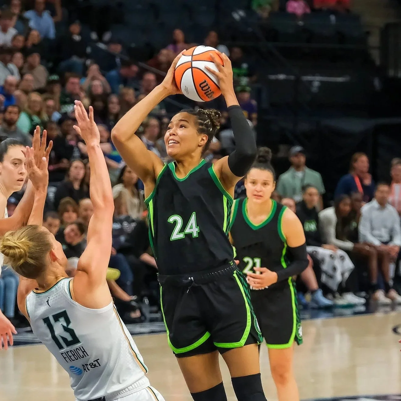 Team Ocean Captain Napheesa Collier gets ready to dunk a basketball