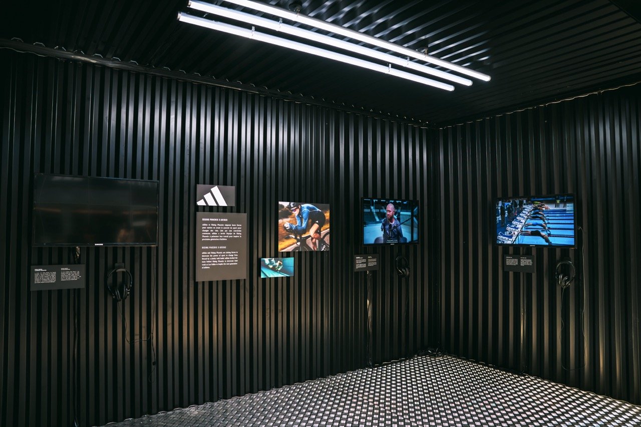 Inside the adidas Rising Phoenix activation at Paris 2024, showcasing the documentary's athletes on various screens