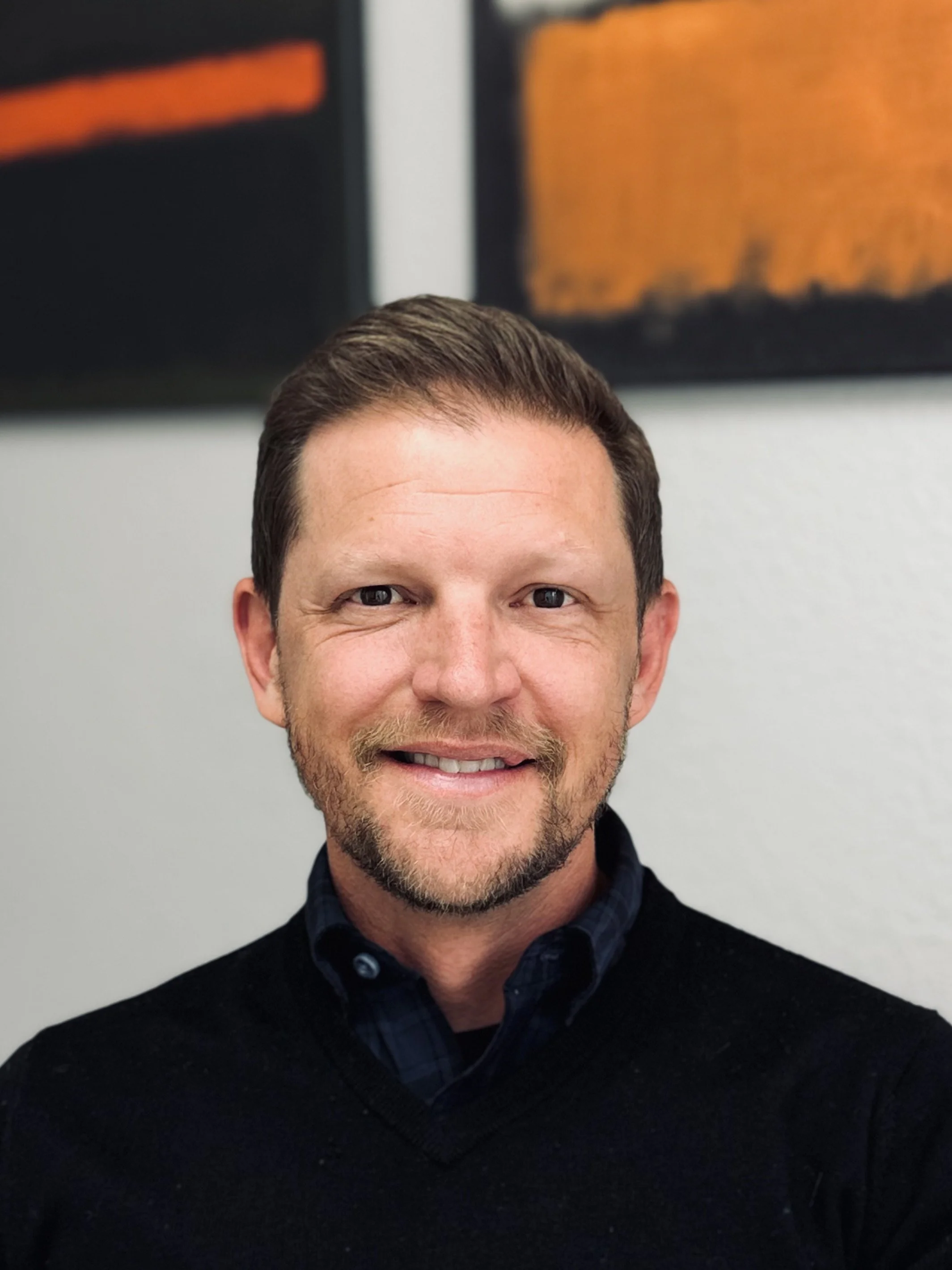 Kevin Lecy, PsyD, psychologist, portrait, private practice, office, smile, kind, warm, compassion, welcoming, supportive, strength-based, walnut creek, San Rafael, East Bay, Marin County, California, smart, bright eyes, therapist, clinical psychology