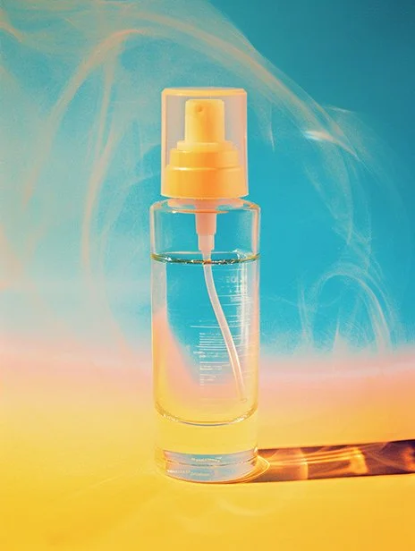 Clear spray bottle with yellow spray nozzle and cap on a colorful background. Ai Generated, Creative direction with  AI 