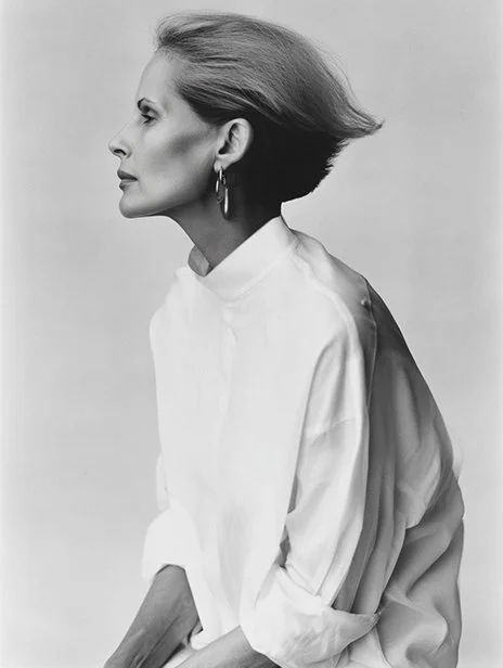 Black and white photo of an elegant woman in profile with short hair, wearing a white blouse and hoop earrings. Ai Generated, Creative direction with  AI 