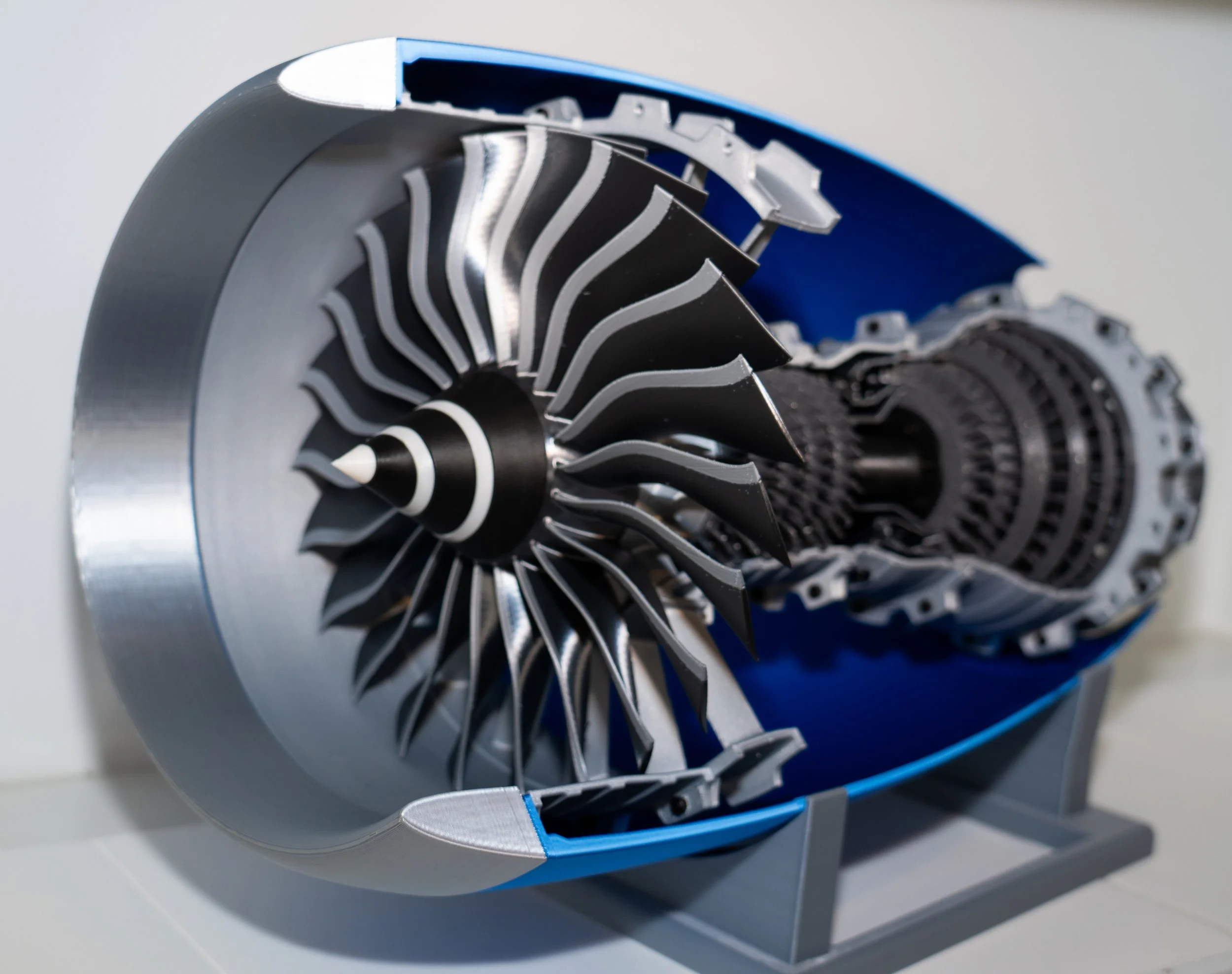 Cross-section of a jet engine showing turbine blades and internal components.