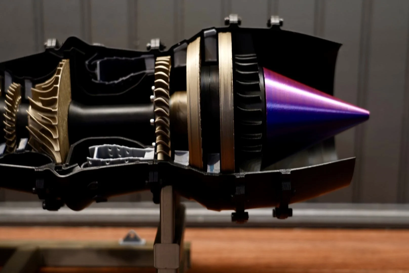 Cross-section view of a large missile, showing its internal components and structure, placed on a stand.