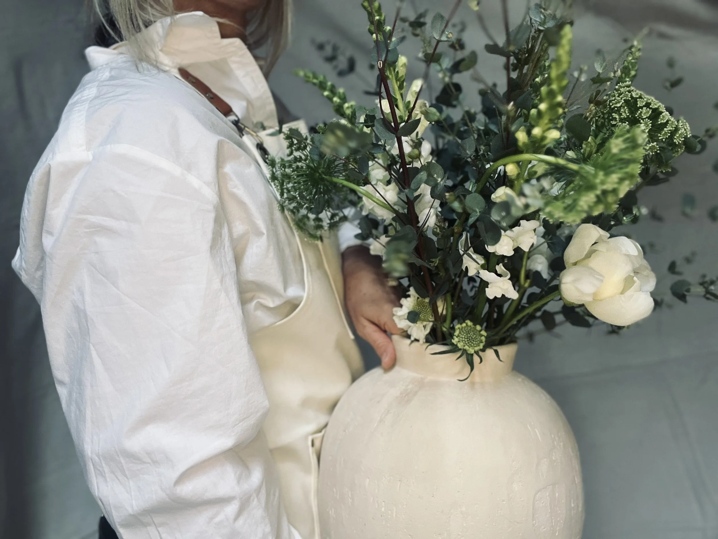 holding vase side.jpeg
