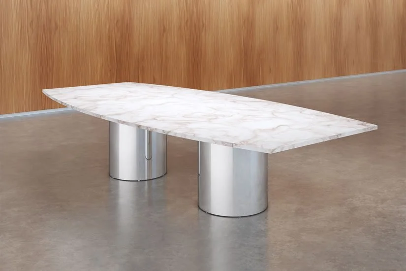 Boat shaped Drum conference room table with natural stone marble tabletop and polished aluminum bases.