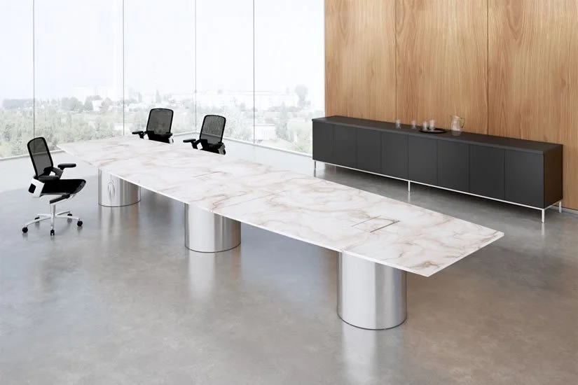 Very long boat shaped Drum conference room table with a marble natural stone tabletop and polished aluminum bases.