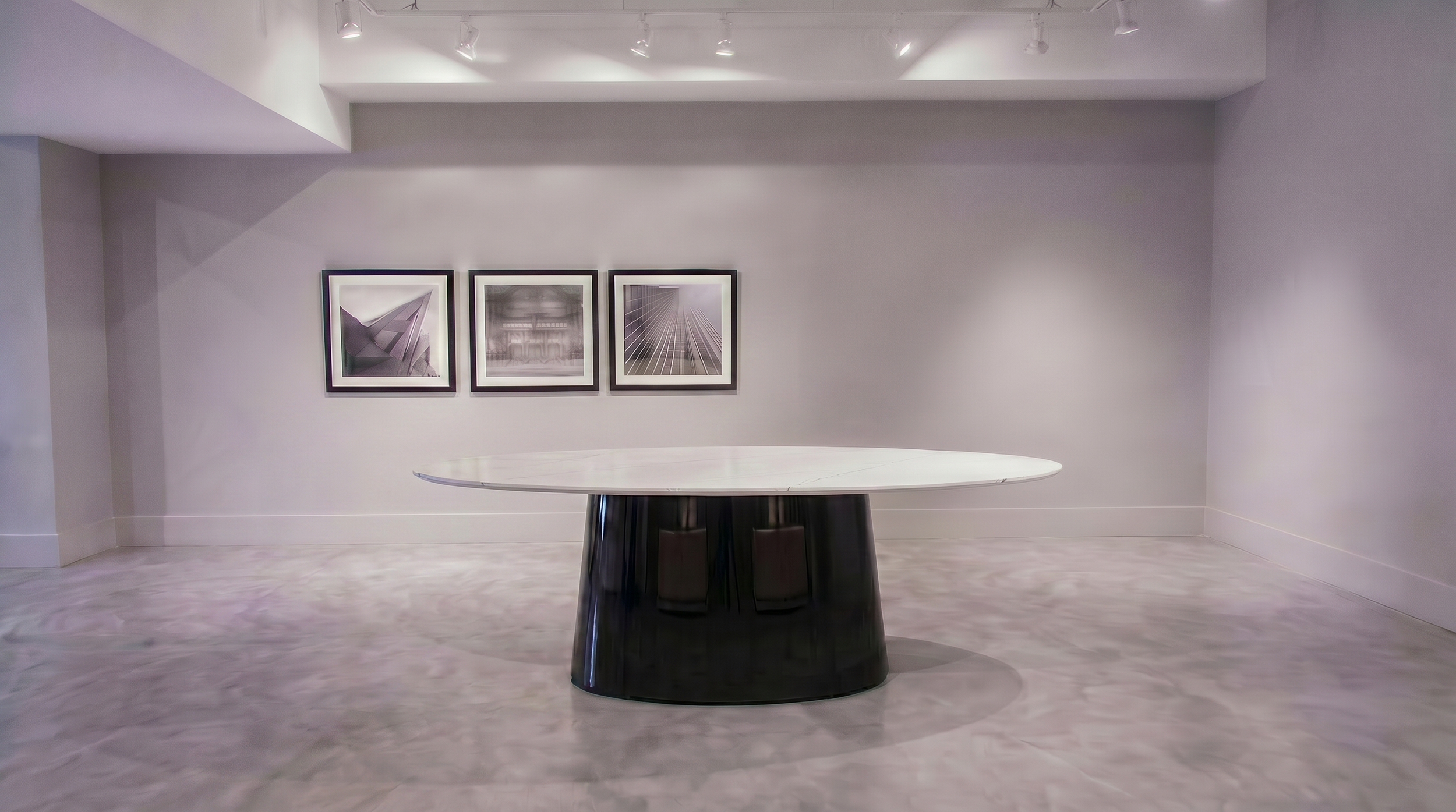 Large Spire based meeting table with round painted back glass tabletop.