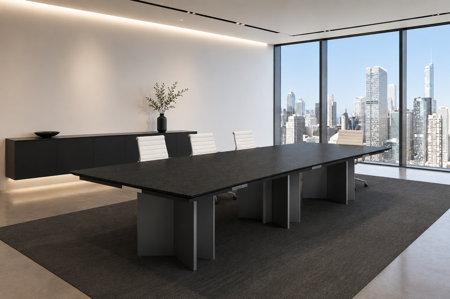 Modern conference room with a large black table, white chairs, a black sideboard with a decorative bowl and a plant, and floor-to-ceiling windows with a city skyline view.
