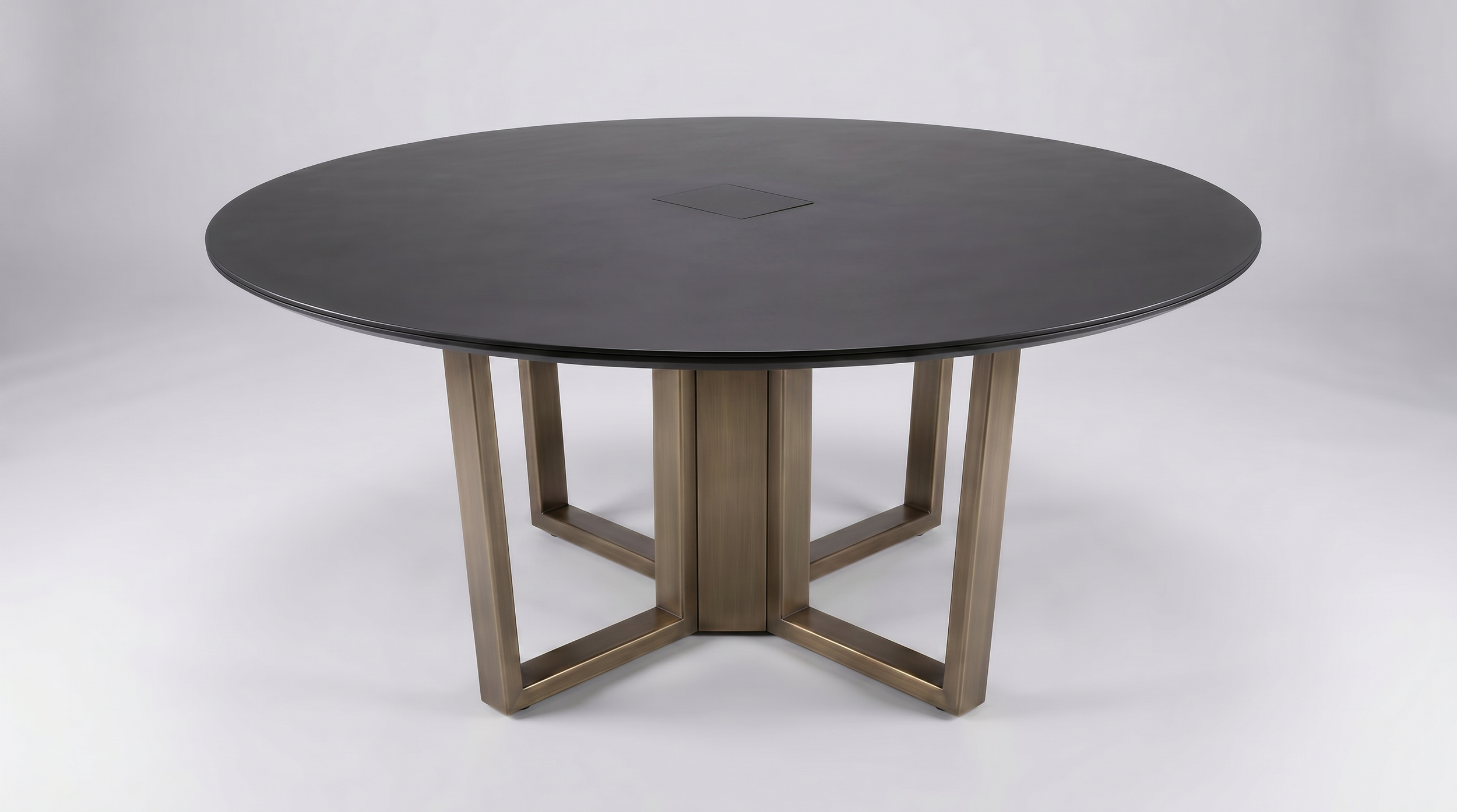 Ribbon cross table with black round tabletop and bronze base.