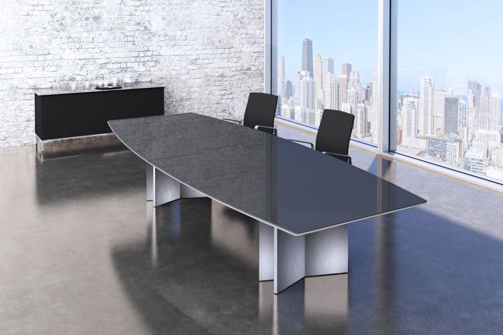 Modern conference room with a large glass table, two black chairs, white brick wall, and city skyline view through floor-to-ceiling windows.