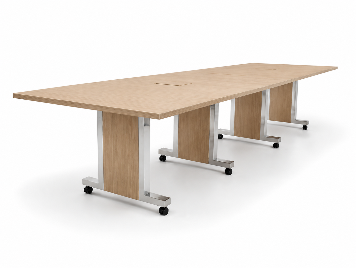 A modern conference table made of light wood with metal U-shaped legs on casters.