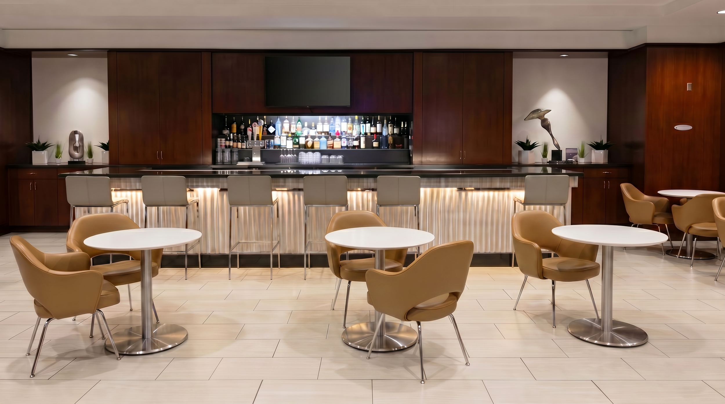 Cafe and bar location with Beveled Plate tables with white tabletops and chrome bases.
