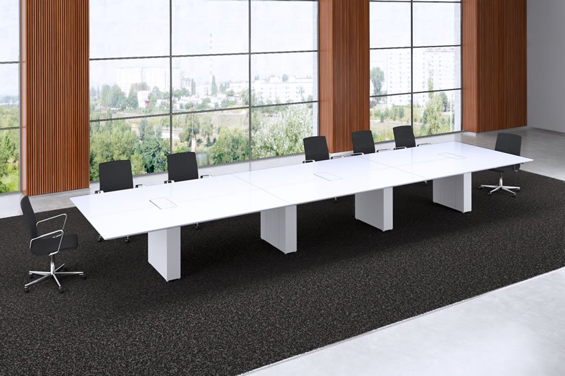 Long rectangle Cube conference room table with whitepainted back glass tabletop and matching white bases.