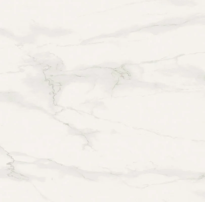White marble surface with subtle gray veining patterns.