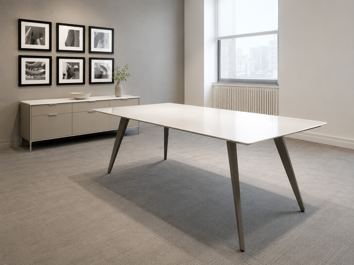 Flatiron conference room table with natural stone tabletop and black base.