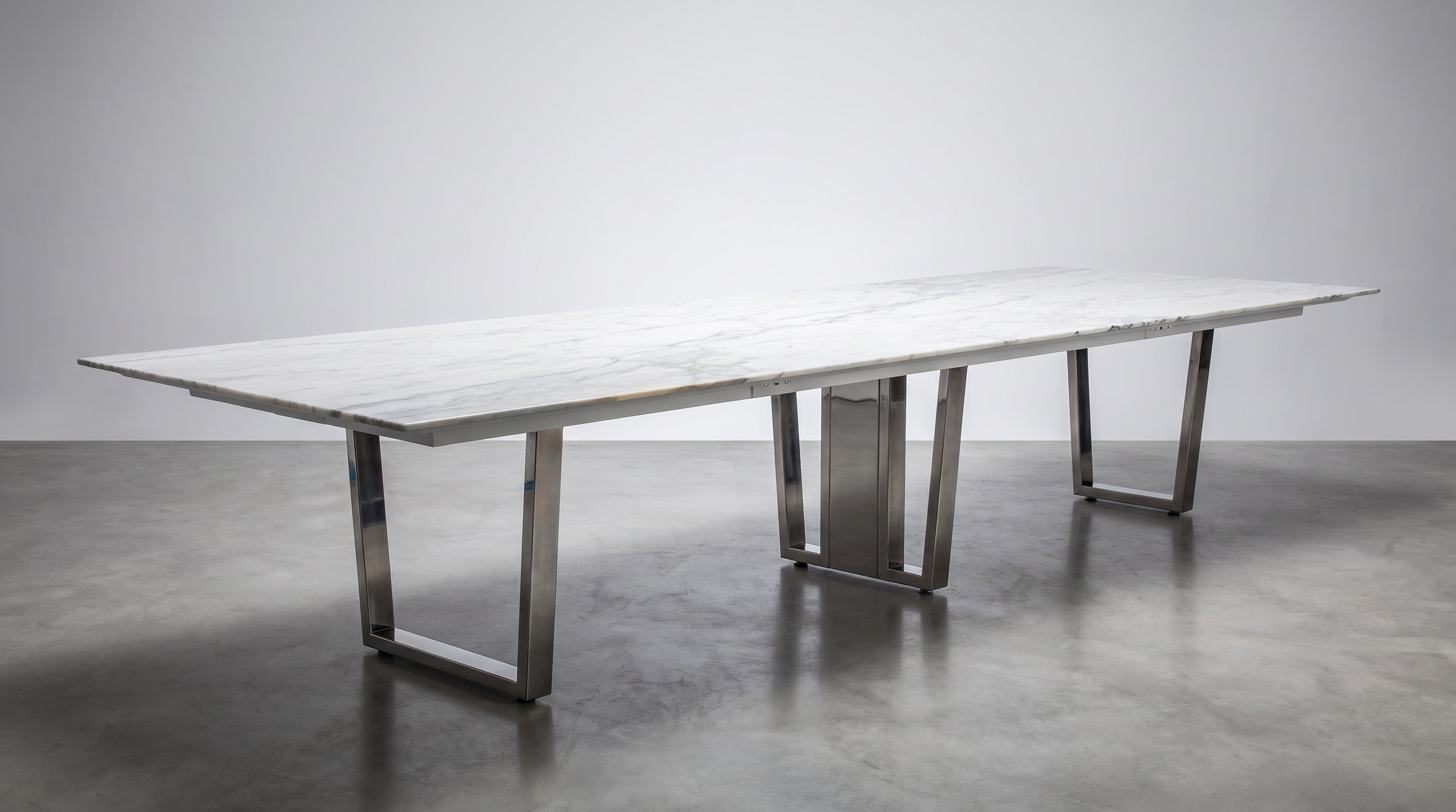 Ribbon conference table with stone table top and chrome base.