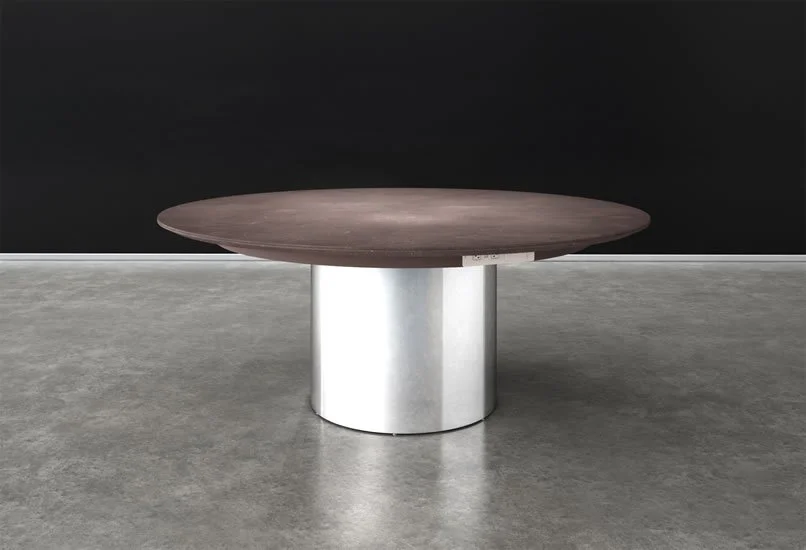 Round wood veneer single drum table with chrome base.