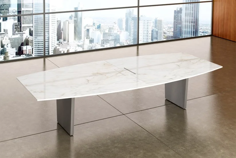 Modern office with a marble-top conference table and large windows overlooking a city skyline.