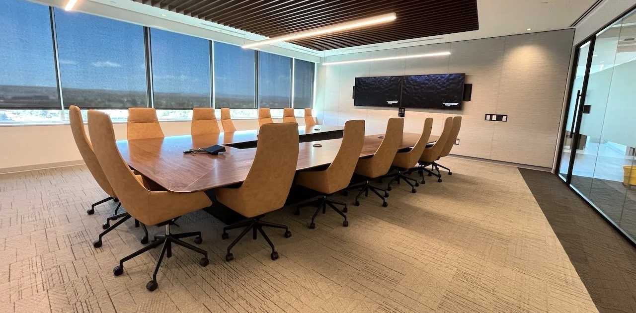 V-Shaped conference room table with wood veneer tabletop.