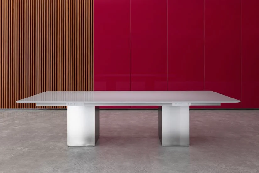 Rectangle Cube conference room table with painted back glass tabletop and brushed aluminum bases.