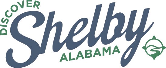 Discover Shelby, Alabama logo with stylized text and a leaf icon.