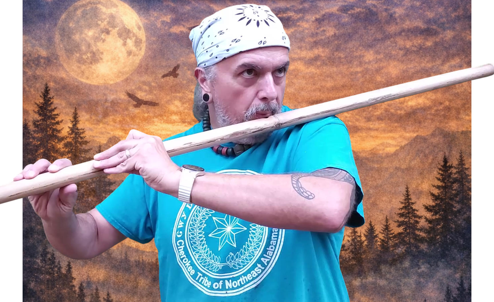 Charlie Mato-Toyela playing a wooden flute in front of a fantasy-themed background featuring a large full moon, flying bats, and a forest silhouette at sunset.