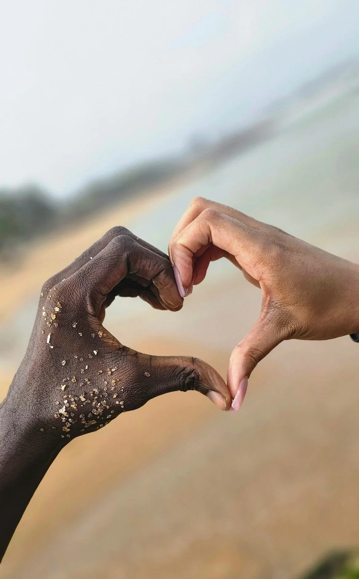 Couple making a heart with their hands