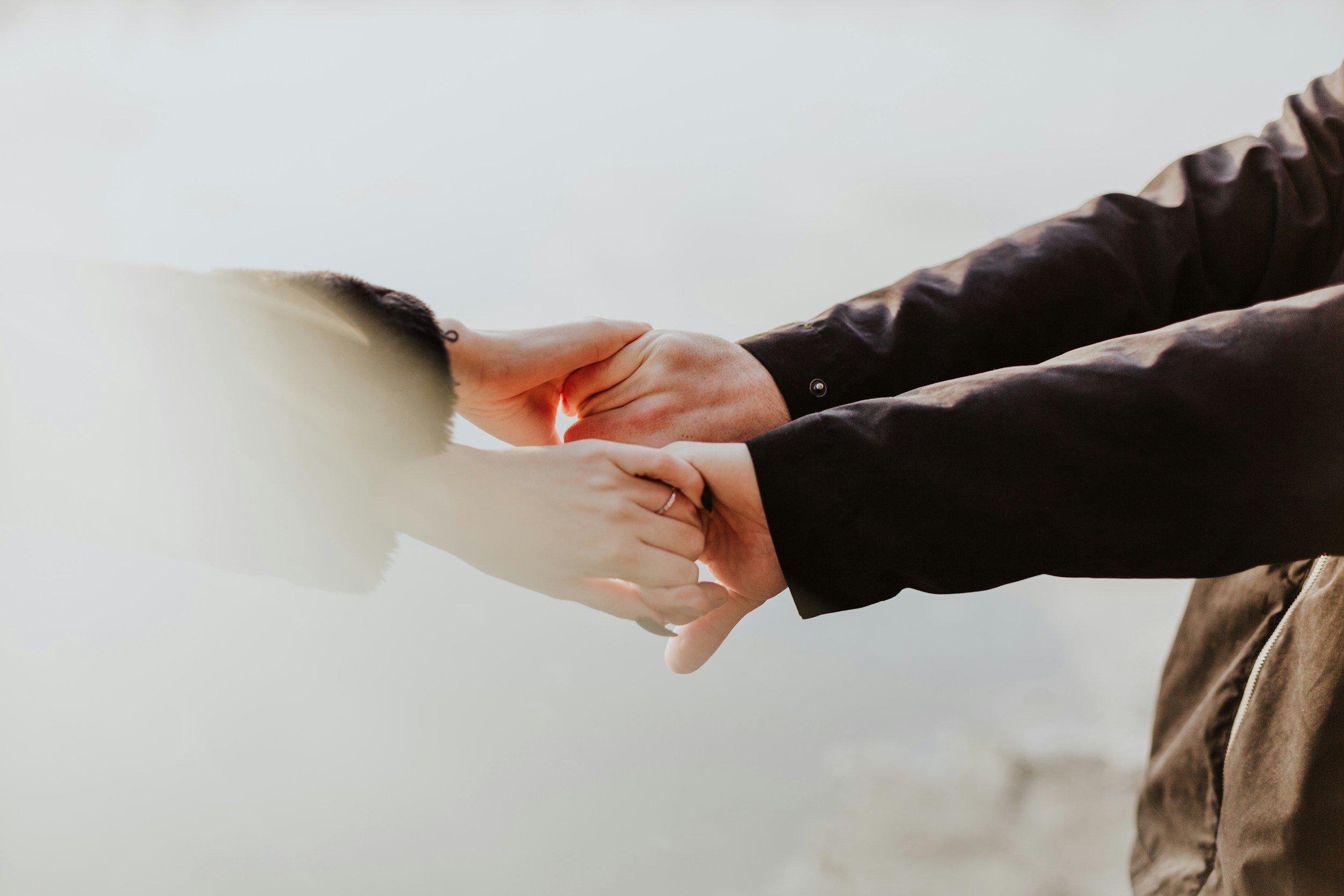 A coupleholding hands symbolizing affair recovery through infidelity counseling in Raleigh, NC.