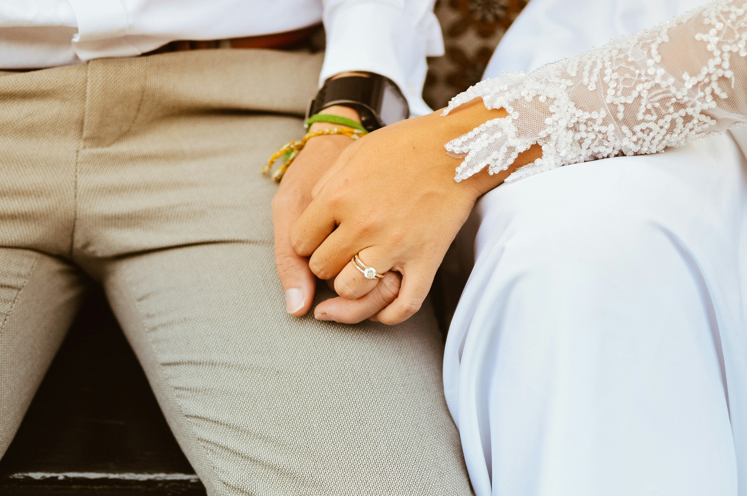 A couple holding hands after engagement participating in premarital counseling in Raleigh, NC