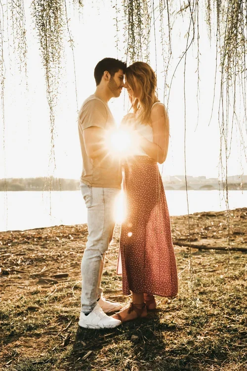 A connected couple sharing a warm moment at home, reflecting the relationship support offered through premarital counseling in Raleigh, NC.