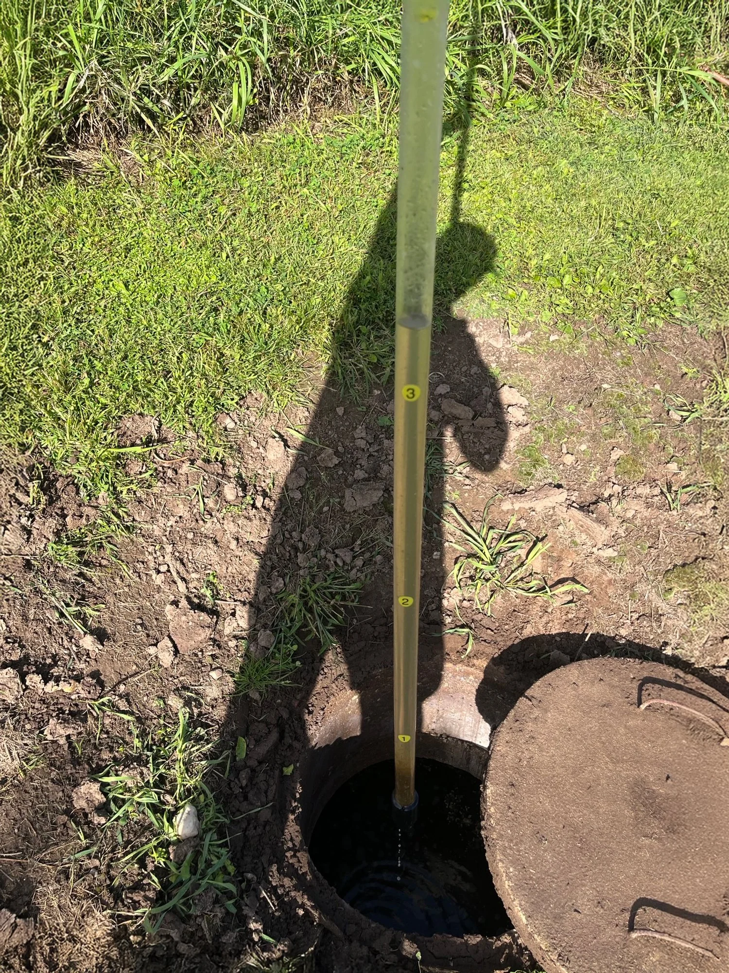 Shiocton, WI septic inspector checking a tank